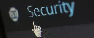 Cursor pointing to word "Security" on a computer screen. Cyber liability insurance protects against hackers and other cyber threats.